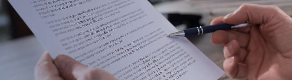 Paper with writing and pen