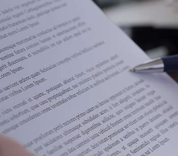 Paper with writing and pen