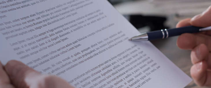 Paper with writing and pen