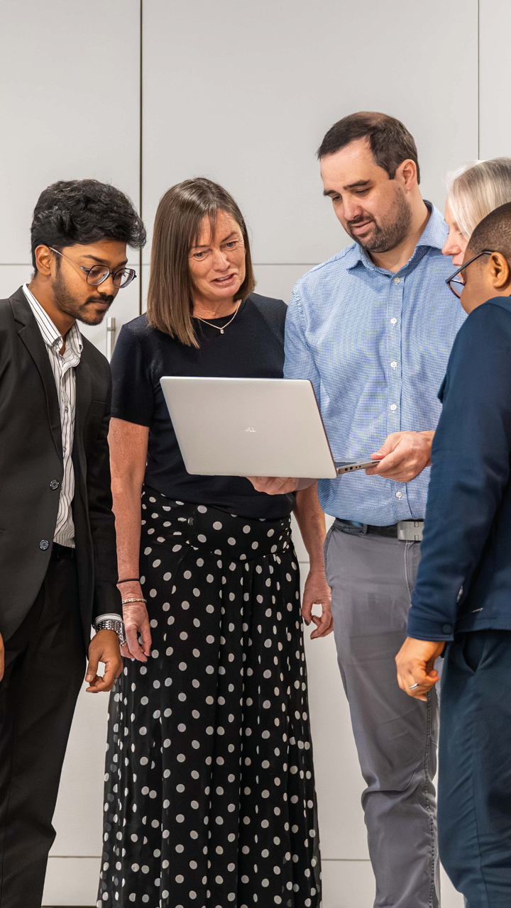 Business services and outsourcing team working together on a client project