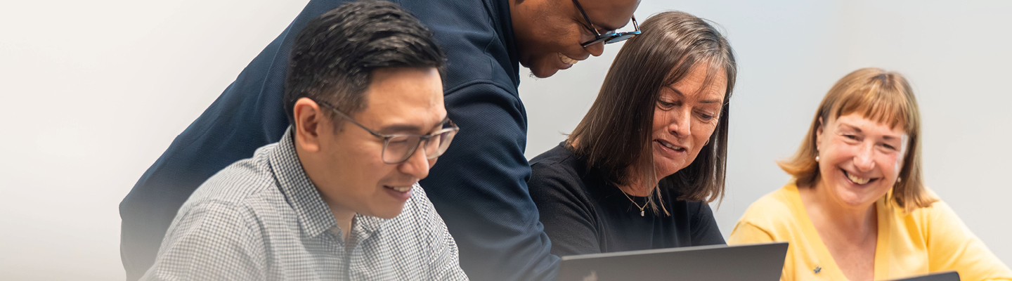 Business services and outsourcing team working together on a client project