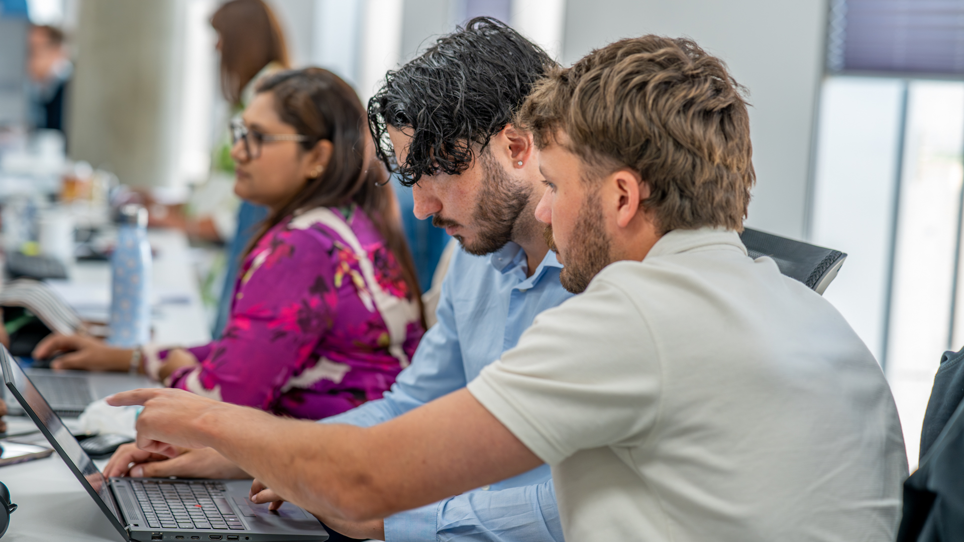 Junior Team members working together at their desks