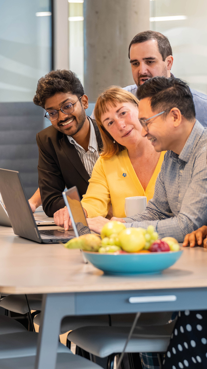 Business services and outsourcing team working together on a client project