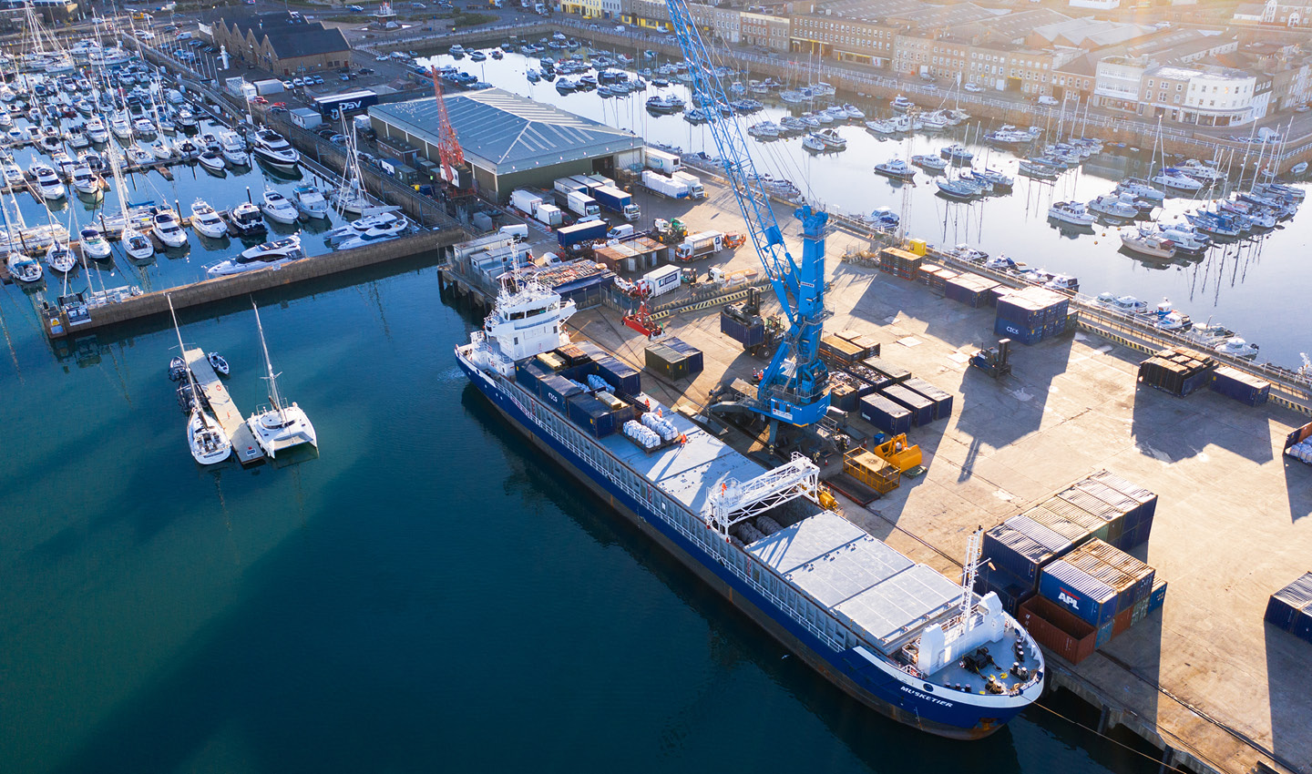 A Ship being unloaded in St Helier Harbour