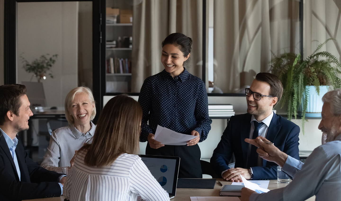 A management consultant leading a board meeting