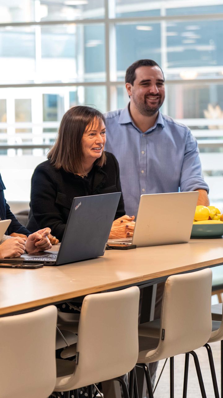 Business services and outsourcing team working together on a client project