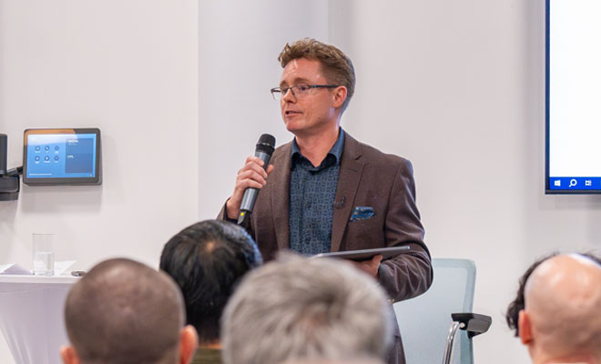 David Scott advisory consultant speaking at a conference.