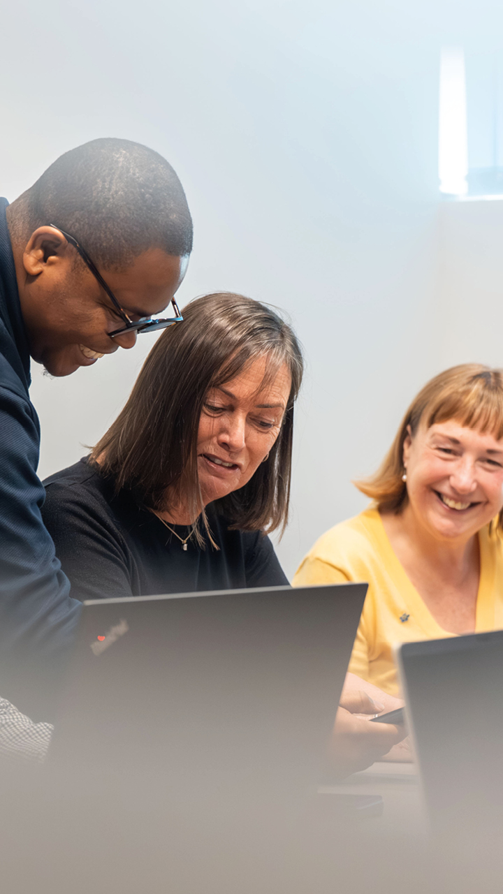 Business services and outsourcing team working together on a client project
