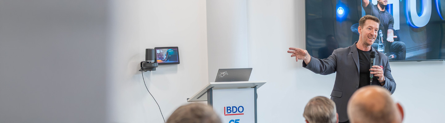 Douglas Kruger speaking at a conference at the BDO Hub in St Helier Jersey.