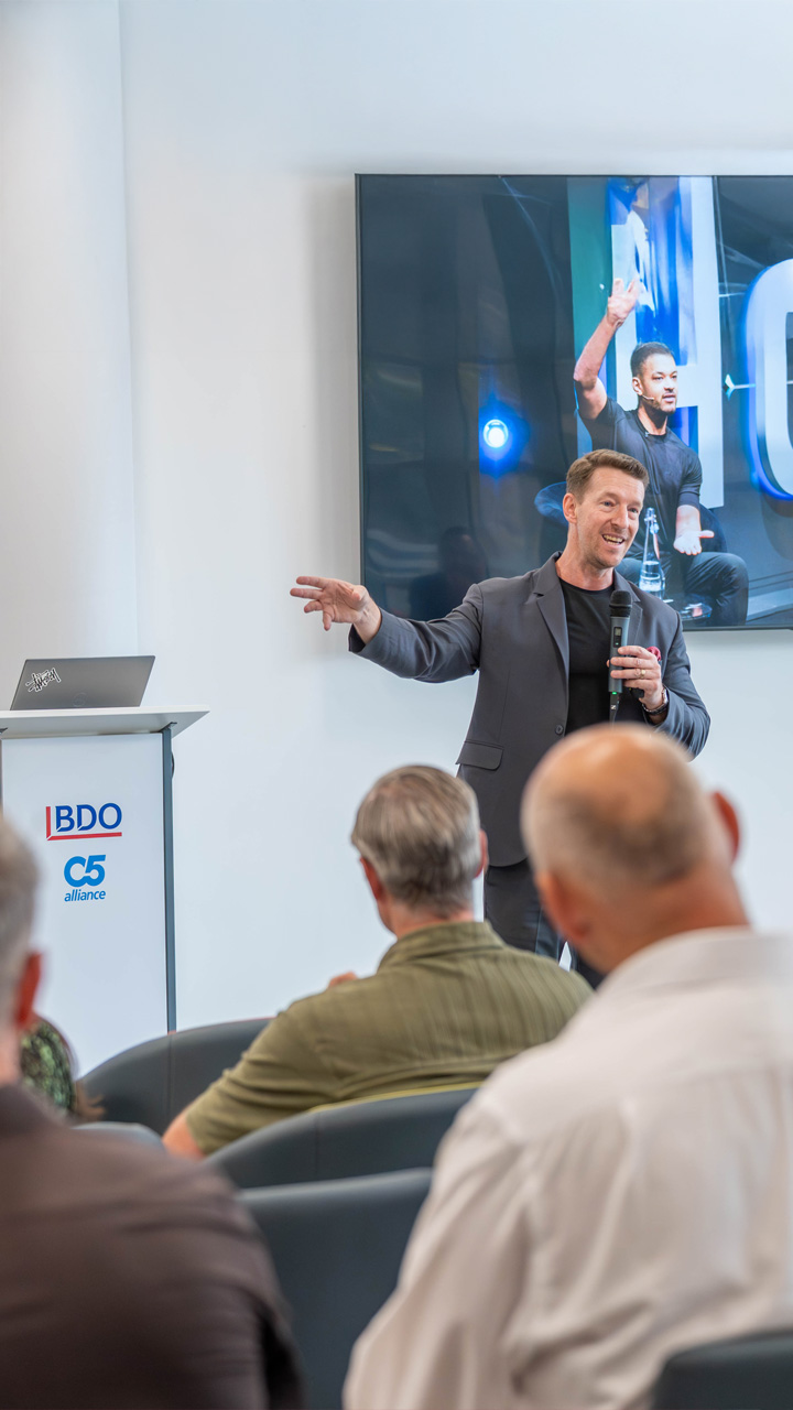 Douglas Kruger speaking at a conference at the BDO Hub in St Helier Jersey.