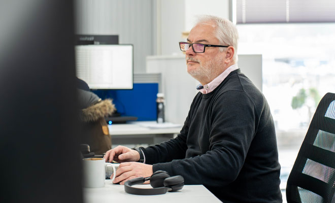 Simon Le Brocq working at laptop