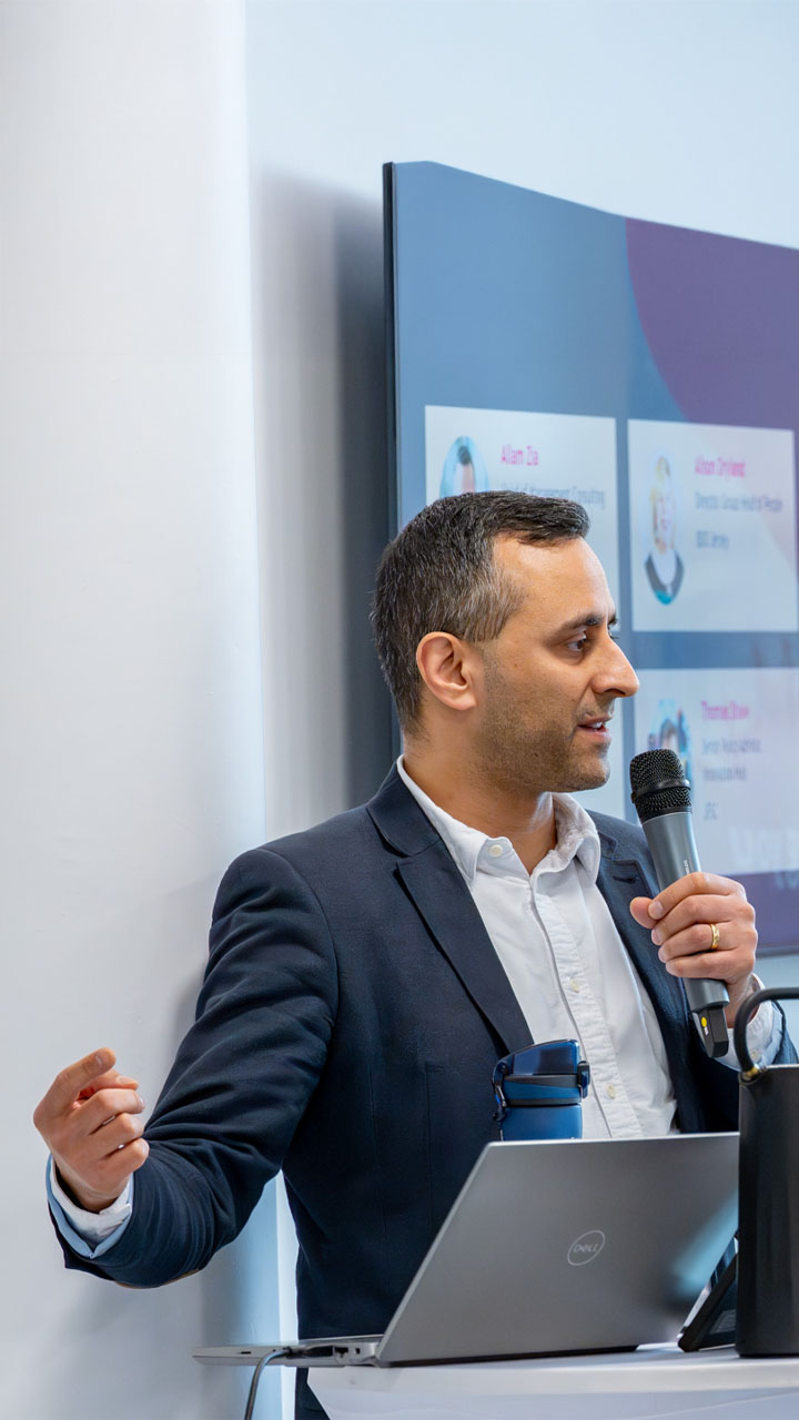 Advisory consultant lecturing at a conference