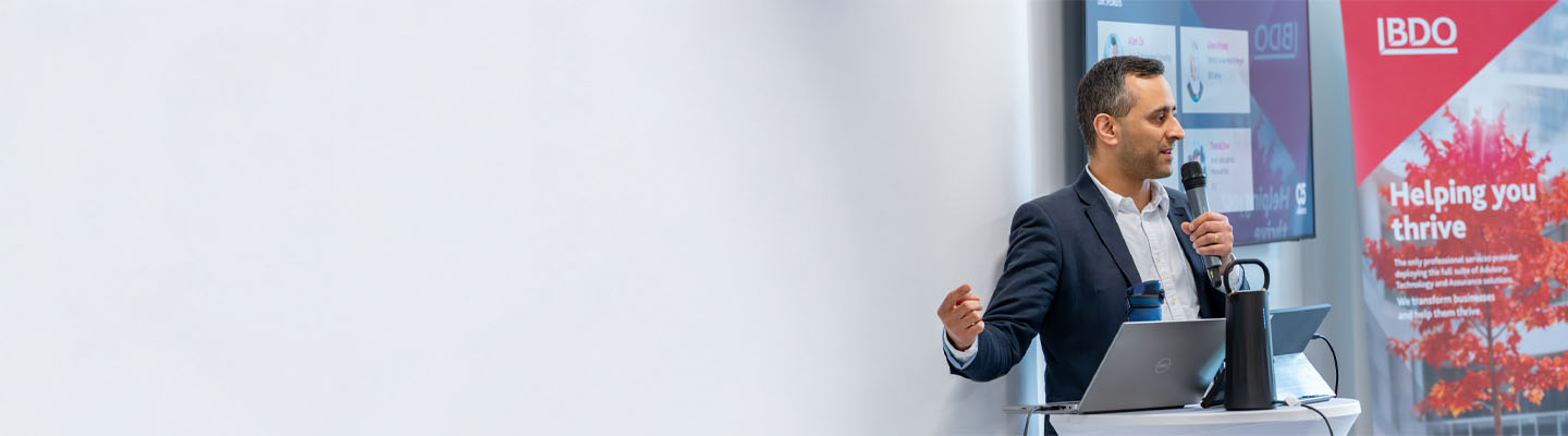 Advisory consultant lecturing at a conference