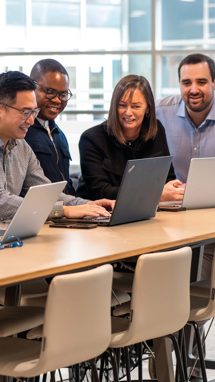 Business services and outsourcing team working together on a client project