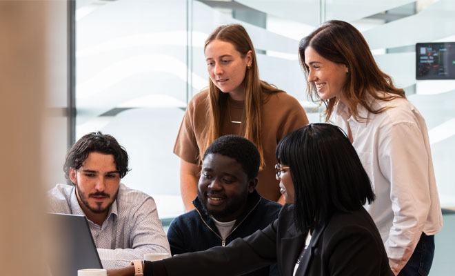 Work experience students being mentored by a BDO Manager