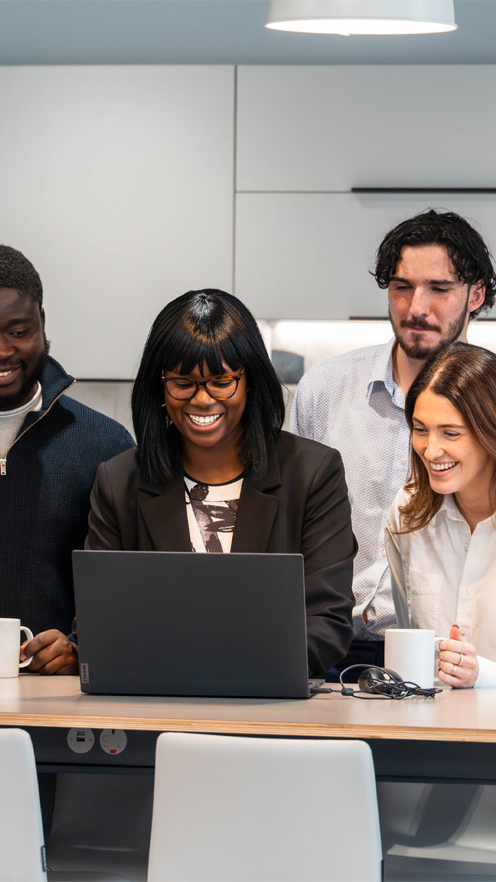 Audit team reviewing client accounts on a laptop